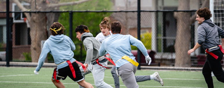 students playing flag football